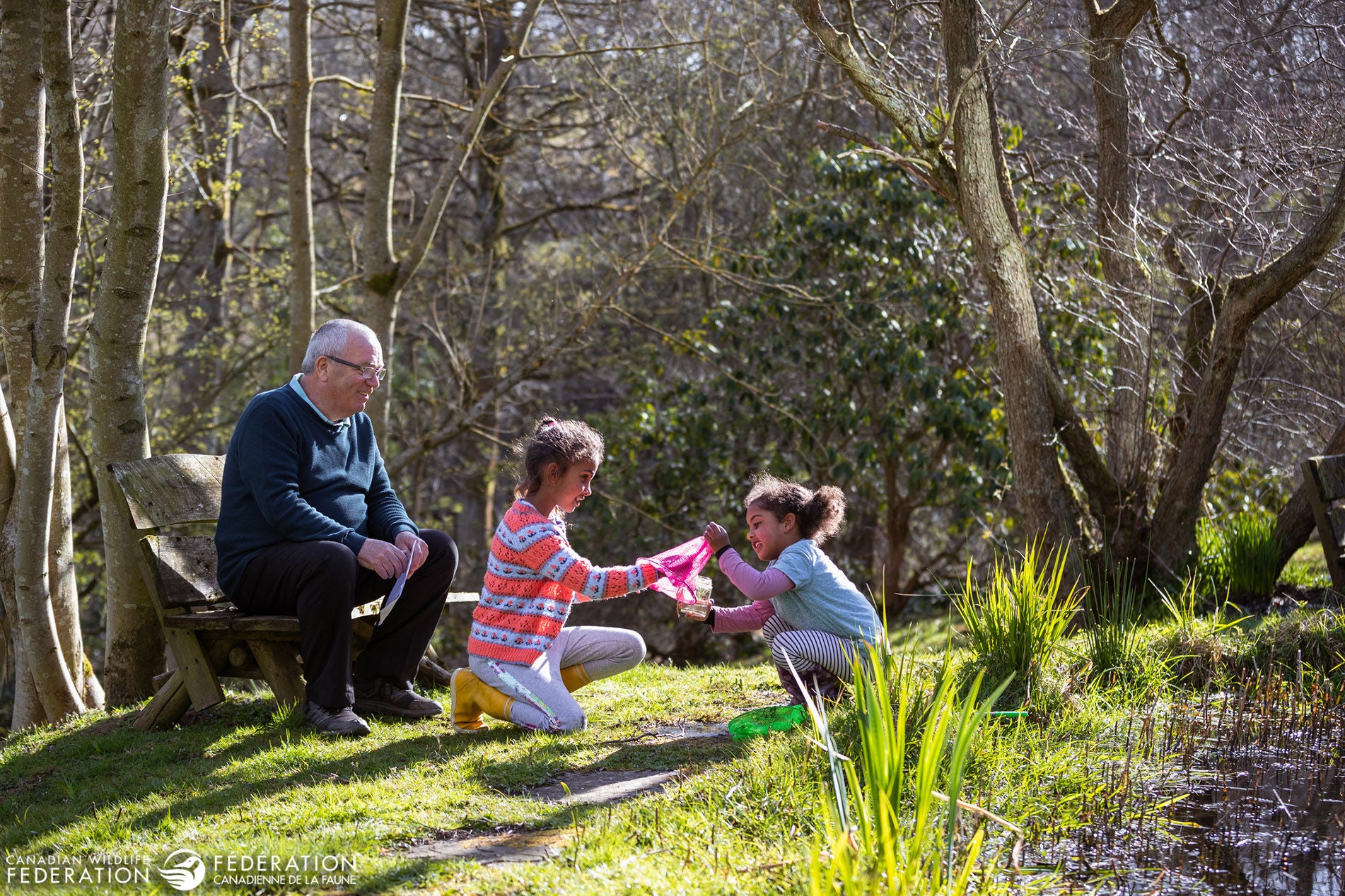 kids grandparent outside clean creek