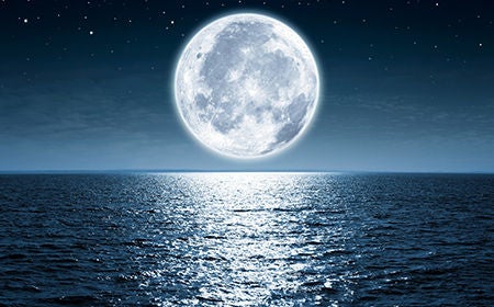 ocean with moon right above