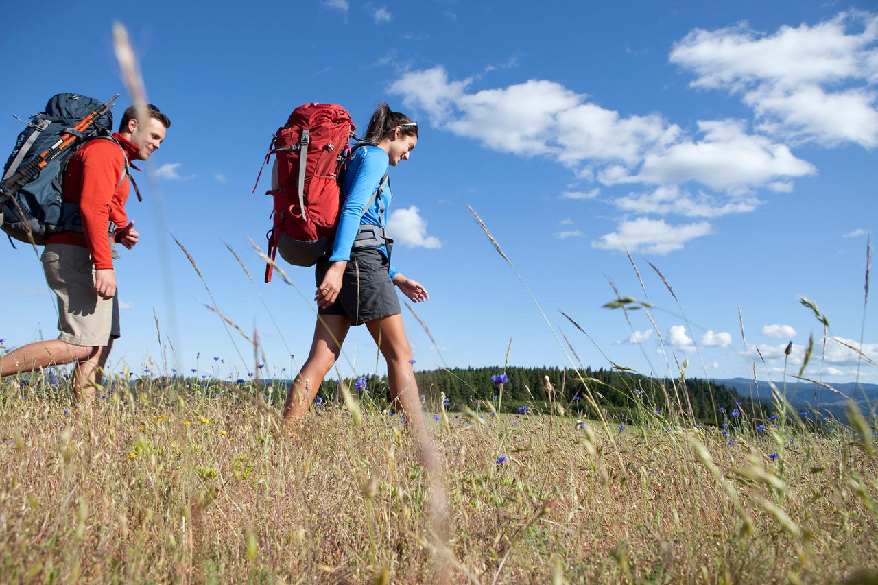 backpacking-couple-man-woman-field-outside.jpg